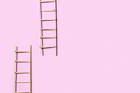 Ladders made of matches on color backgroundの写真素材