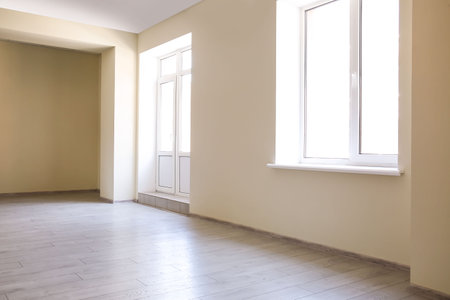 View of big empty room with door and windowの写真素材