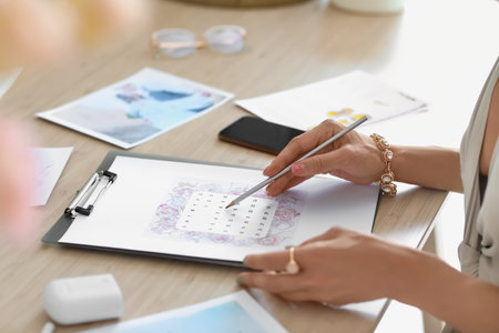 Female wedding planner working in office, closeupの写真素材