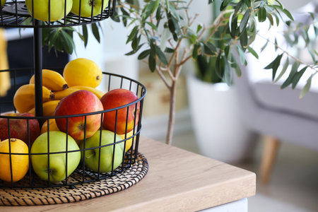 Stand with healthy fruits on counter in modern kitchen, closeupの写真素材