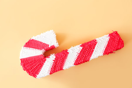 Candy cane pinata on color backgroundの写真素材