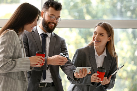 business people having coffee break in officeの写真素材