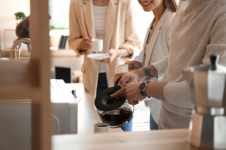People having coffee break in officeの写真素材