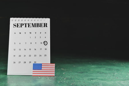 Calendar with date of National Day of Prayer and Remembrance for the Victims of the Terrorist Attacks with USA flag on dark backgroundの写真素材