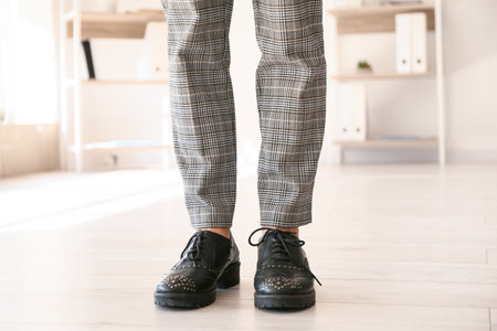 Young woman in modern shoes at homeの写真素材