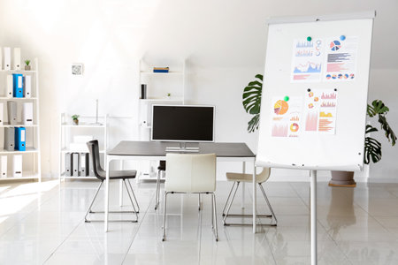 Interior of modern office with whiteboard and table prepared for meetingの写真素材