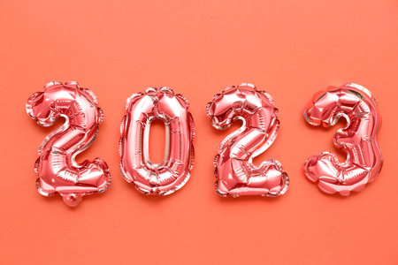 Figure 2023 made of balloons on red backgroundの写真素材