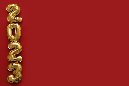 Figure 2023 made of balloons on red background