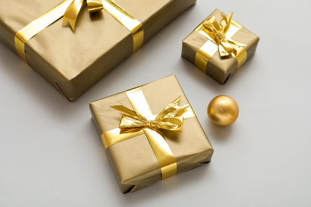 Beautiful Christmas gifts on light background, closeup