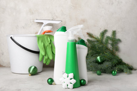 Bottles of detergent with Christmas balls and snowflake on grunge background, closeupの写真素材