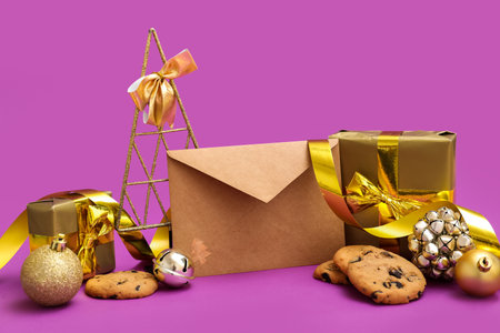Letter to Santa with cookies, presents and Christmas decor on purple backgroundの写真素材