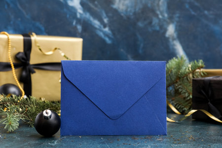 Letter to Santa with Christmas ball on dark background, closeupの写真素材