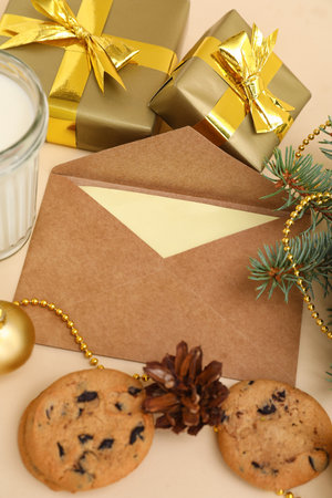 Letter to Santa with cookies and Christmas presents on beige background, closeupの写真素材