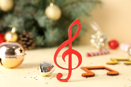 Note signs and Christmas decorations on color background