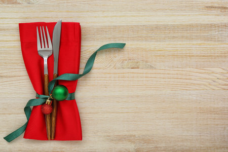 Stylish table setting for Christmas celebration on wooden backgroundの写真素材