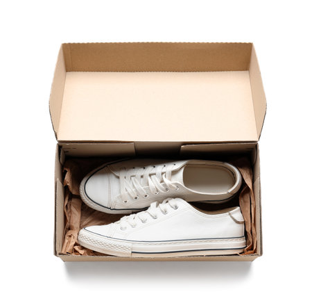 Cardboard box with sneakers on white backgroundの写真素材