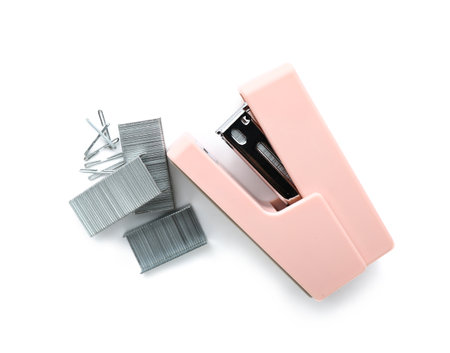 Pink stapler with staples isolated on white background