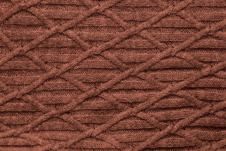 Close up view of knitted fabric with pattern as background