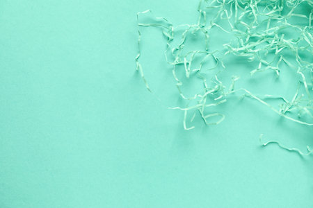 Shredded paper on mint background