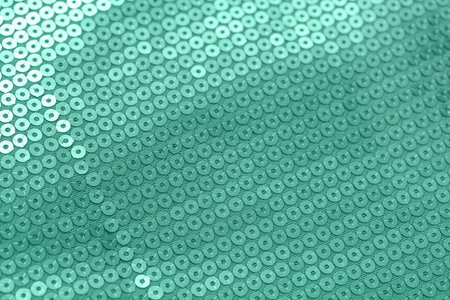 Texture of mint sequin fabric, closeup