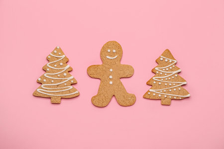 Sweet Christmas cookies on pink background