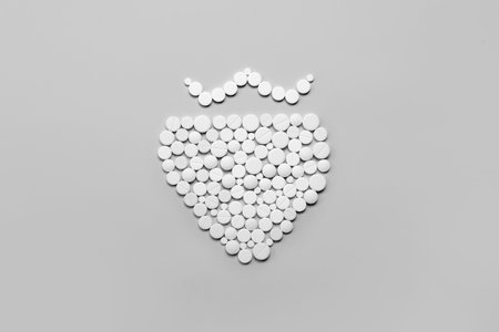 Santa beard made of pills on gray backgroundの写真素材