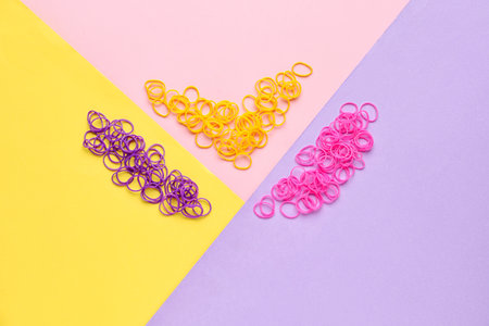Office colorful rubber bands on color background