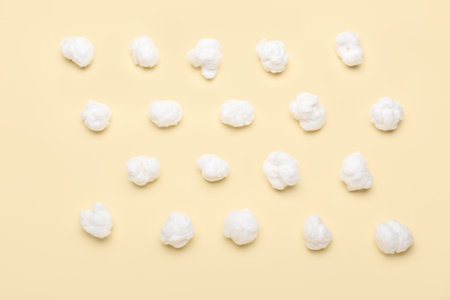 natural cotton wool on yellow backgroundの写真素材