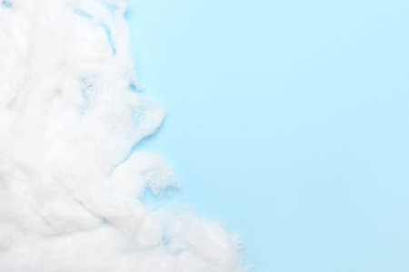 natural cotton wool on blue backgroundの写真素材