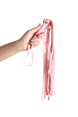 Female hand with whip from sex shop on white backgroundの写真素材