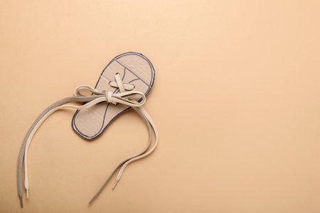 Shoe lacing card with laces on color backgroundの写真素材