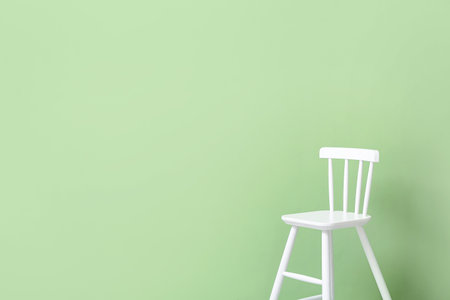 white chair on green backgroundの写真素材
