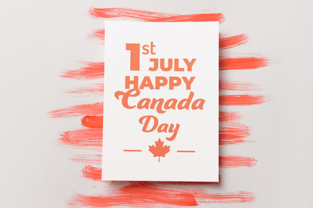 Greeting card with text 1ST JULY HAPPY CANADA DAY on light backgroundの写真素材