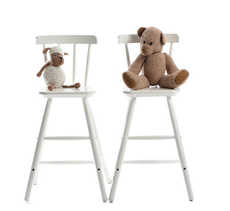 Chairs with toys on white backgroundの写真素材