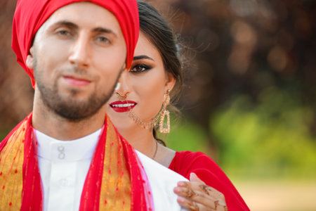Beautiful Indian wedding couple on summer dayの写真素材