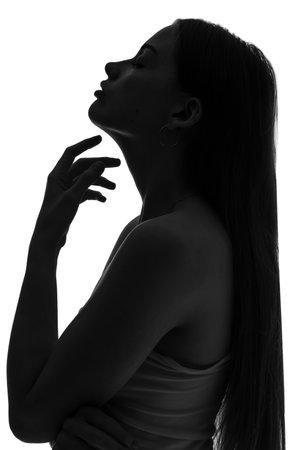Silhouette of young woman on white backgroundの写真素材