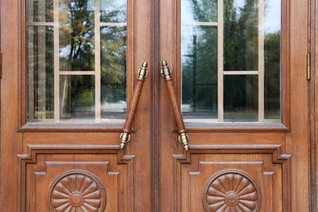 Vintage wooden doors with handles, closeup