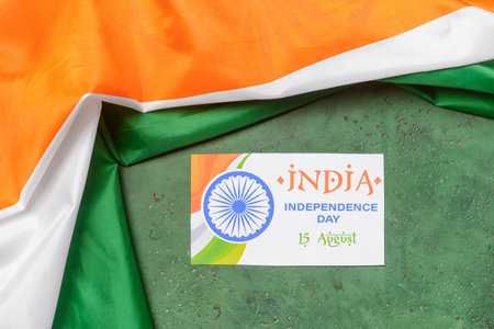 Indian flag and greeting card for Independence Day on color backgroundの写真素材