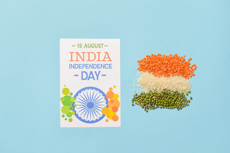 Indian flag made of food and greeting card for Independence Day on color backgroundの写真素材