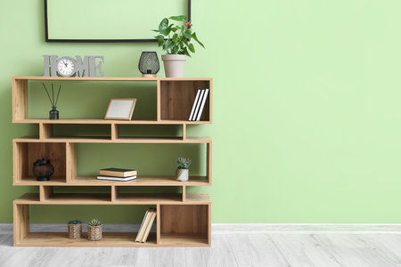 Bookshelf near color wall in living roomの写真素材