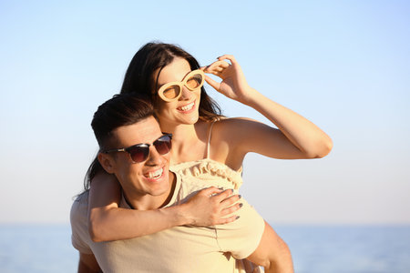 happy young couple on sea beachの写真素材