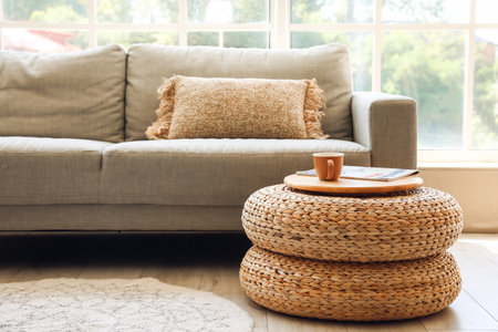 Rattan poufs with cup of coffee and magazine in living room