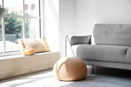 Interior of light living room with poufの写真素材