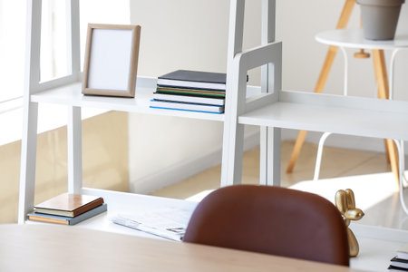 White book shelves with frame in light roomの写真素材