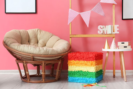 Interior of stylish room with Mexican pinata and armchairの写真素材