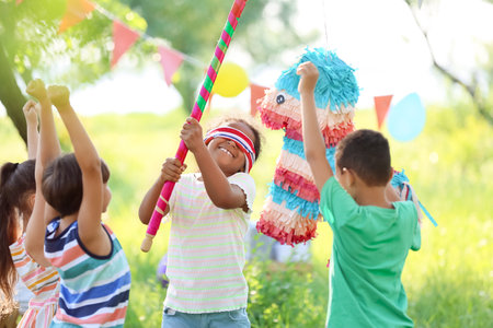Cute children at pinata birthday party