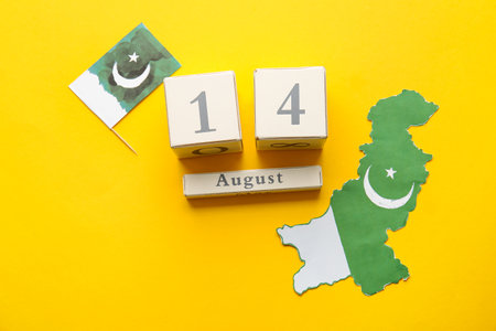 Flag and map of Pakistan, calendar with date of Independence Day on color background