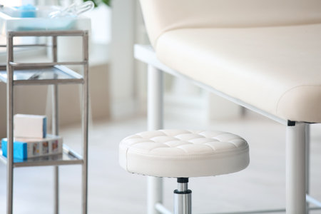 Modern couch and stool in medical office, closeupの写真素材
