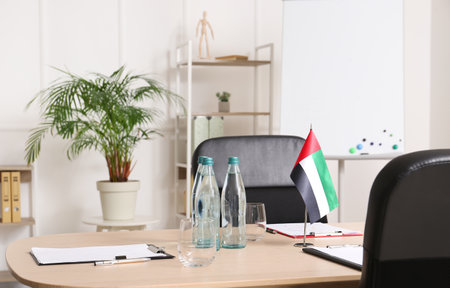 Modern office with UAE flag prepared for business meetingの写真素材