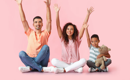 Happy interracial family on color backgroundの写真素材